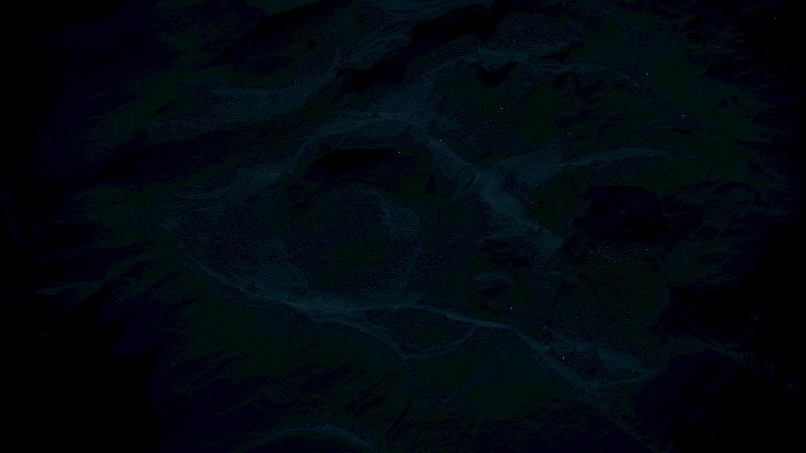 The image appears to be very dark and abstract with indistinct shapes and a low-contrast color palette, making details hard to discern.