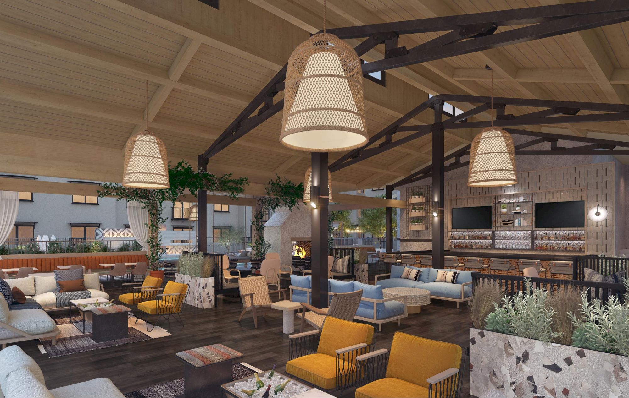 The image shows a cozy, modern lounge area with wooden ceilings, pendant lights, sofas, plants, and a fireplace setting.